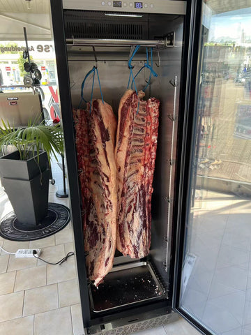 Store features a dedicated dry-aging cabinet.